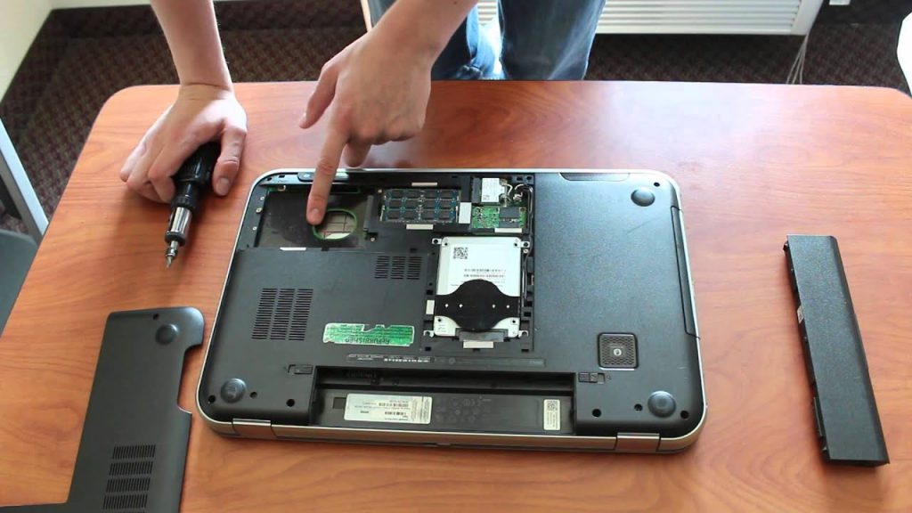 a laptop being taken apart